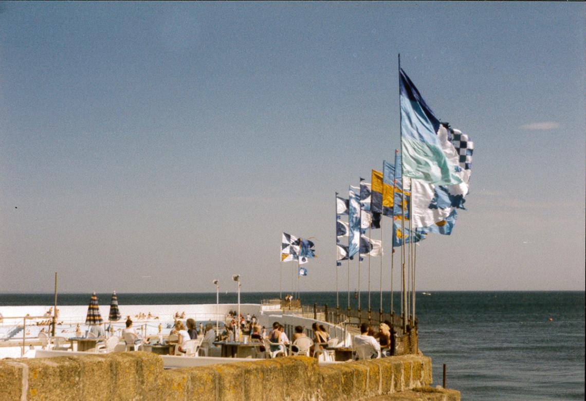 Flags and people on the top terrace