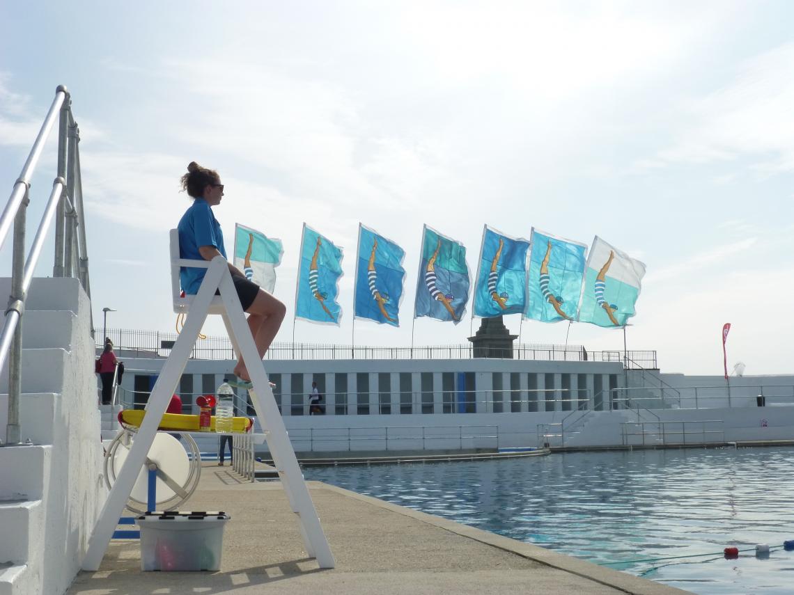 Flags at Jubilee Pool and lifeguard