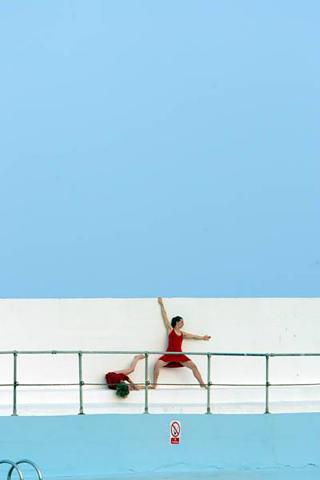 Live art at the pool - red performers