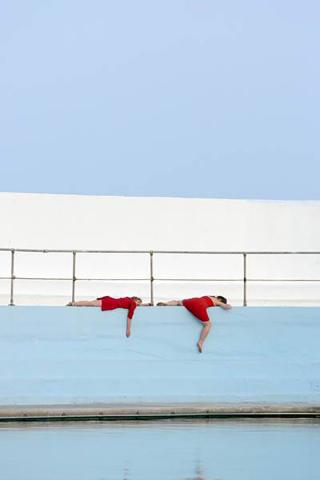Live art at the pool - red performers 2