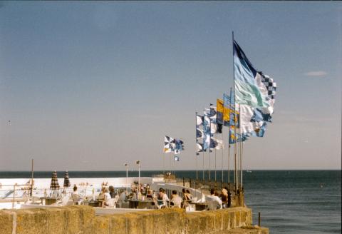 Flags and people on the top terrace
