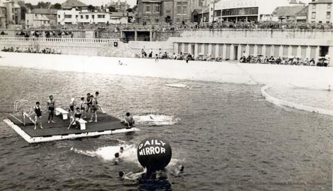 Raft, swimmers and ball